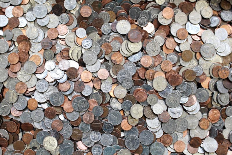 many different coins on the floor
